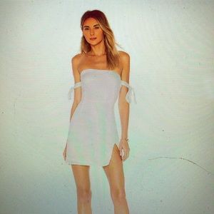 White mini dress with bow tie sleeves